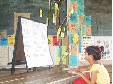 Girl with visual impairment at school
